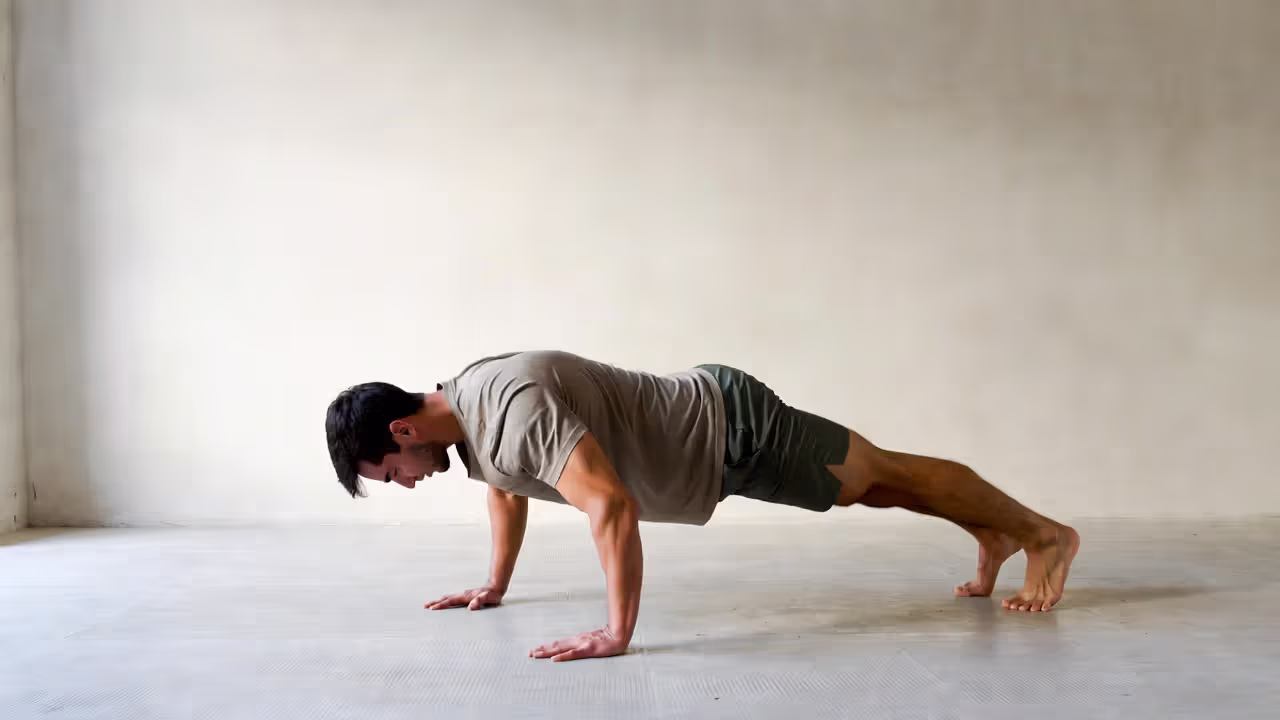 Person performing a bodyweight squat during a short morning workout at home