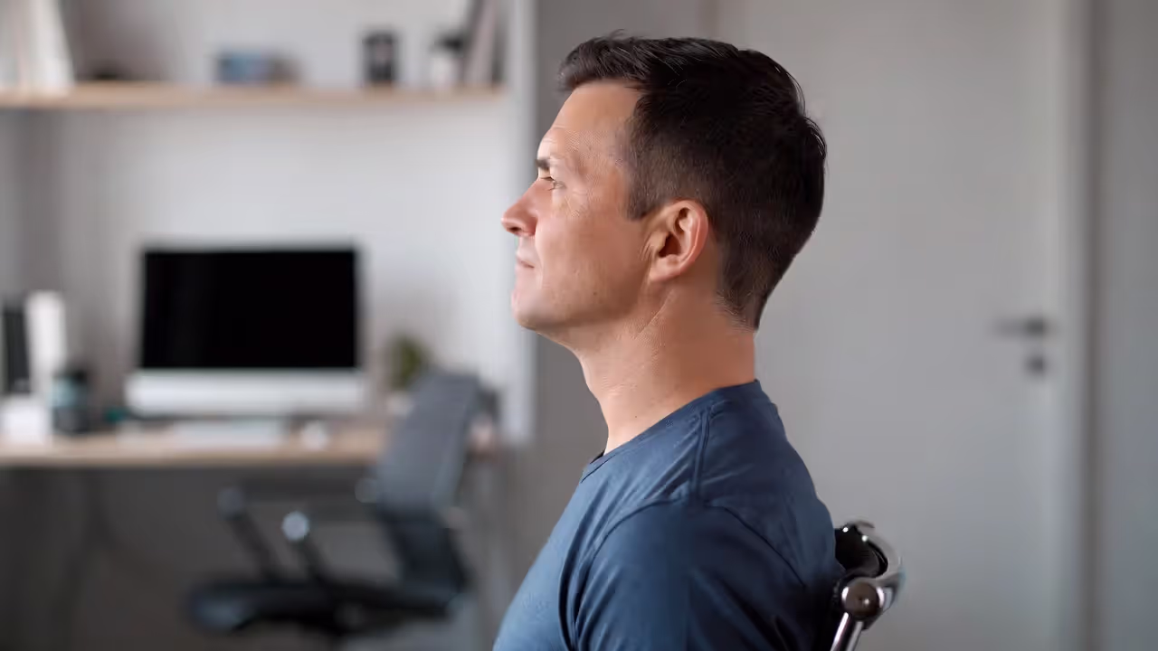 Seated chin tuck exercise for neck posture alignment
