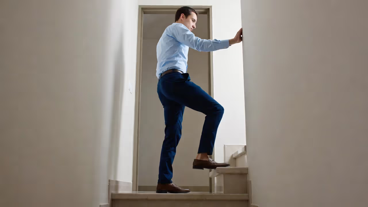 Person doing controlled step-ups on a low step with steady posture
