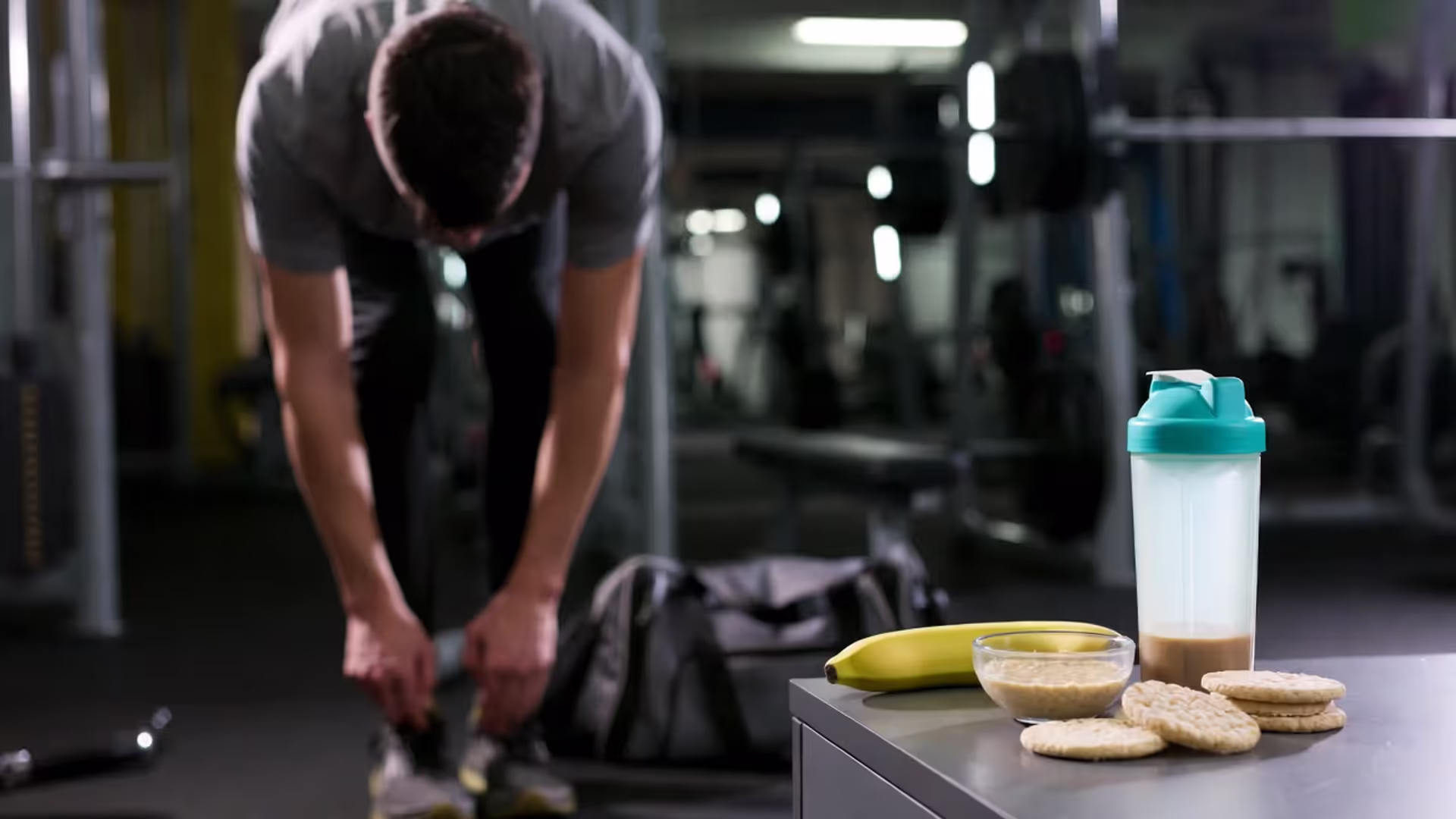 Pre-workout foods (banana, oatmeal, rice cakes with honey) next to a person preparing to train.
